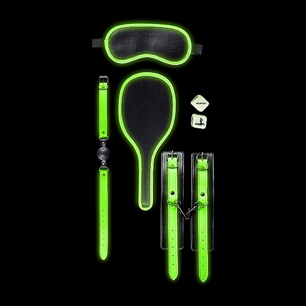 Glow in the dark bondage kit with eye mask, paddle, ball gag, dice, and cuffs.