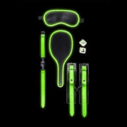 Glow in the dark bondage kit with eye mask, paddle, ball gag, dice, and cuffs.