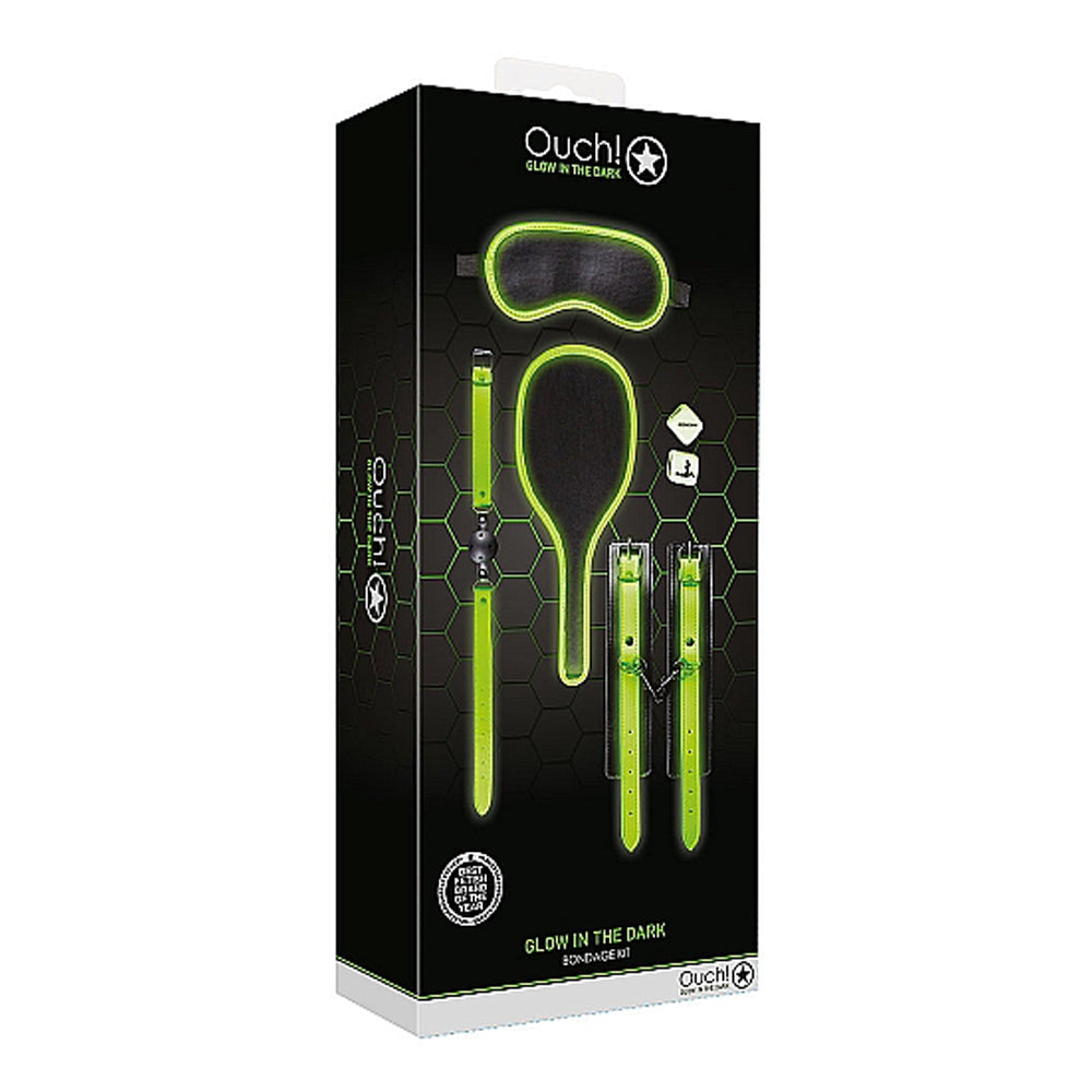 Glow in the dark bondage kit with eye mask, paddle, and cuffs.