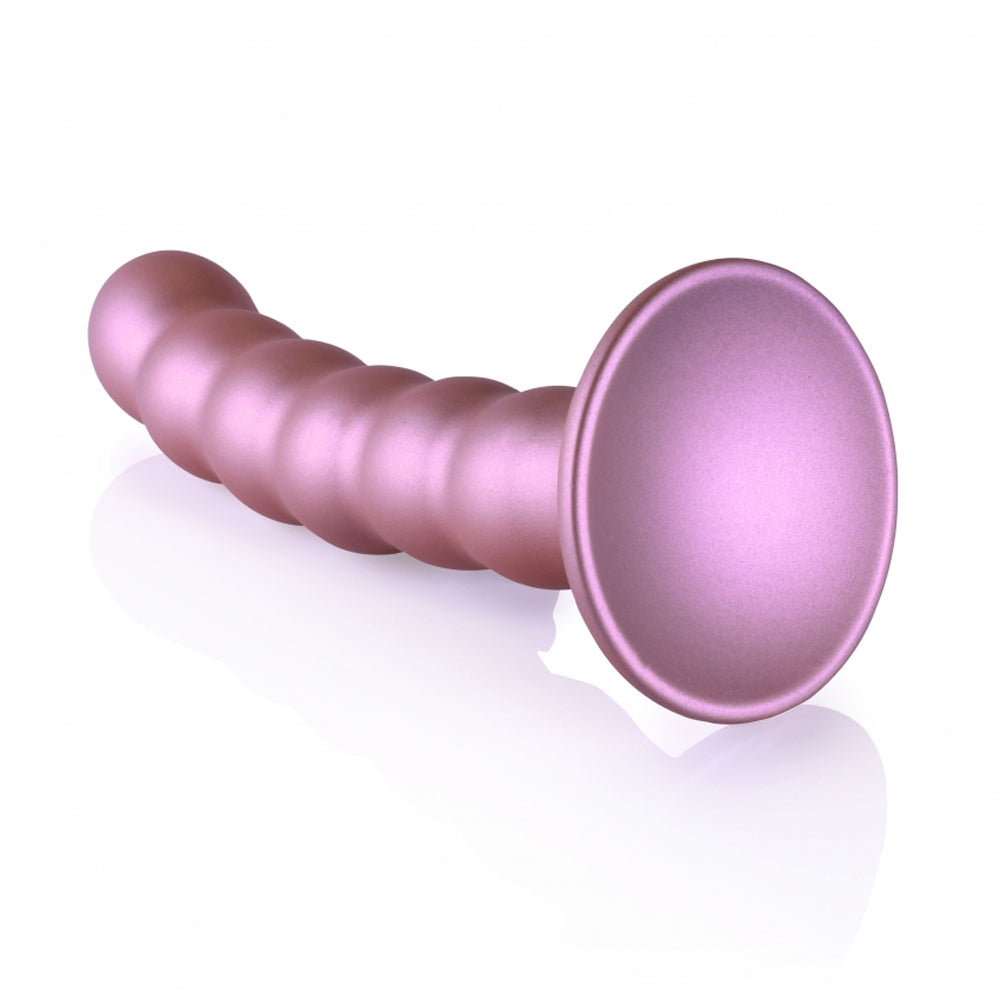Pink beaded silicone dildo with a suction cup base.