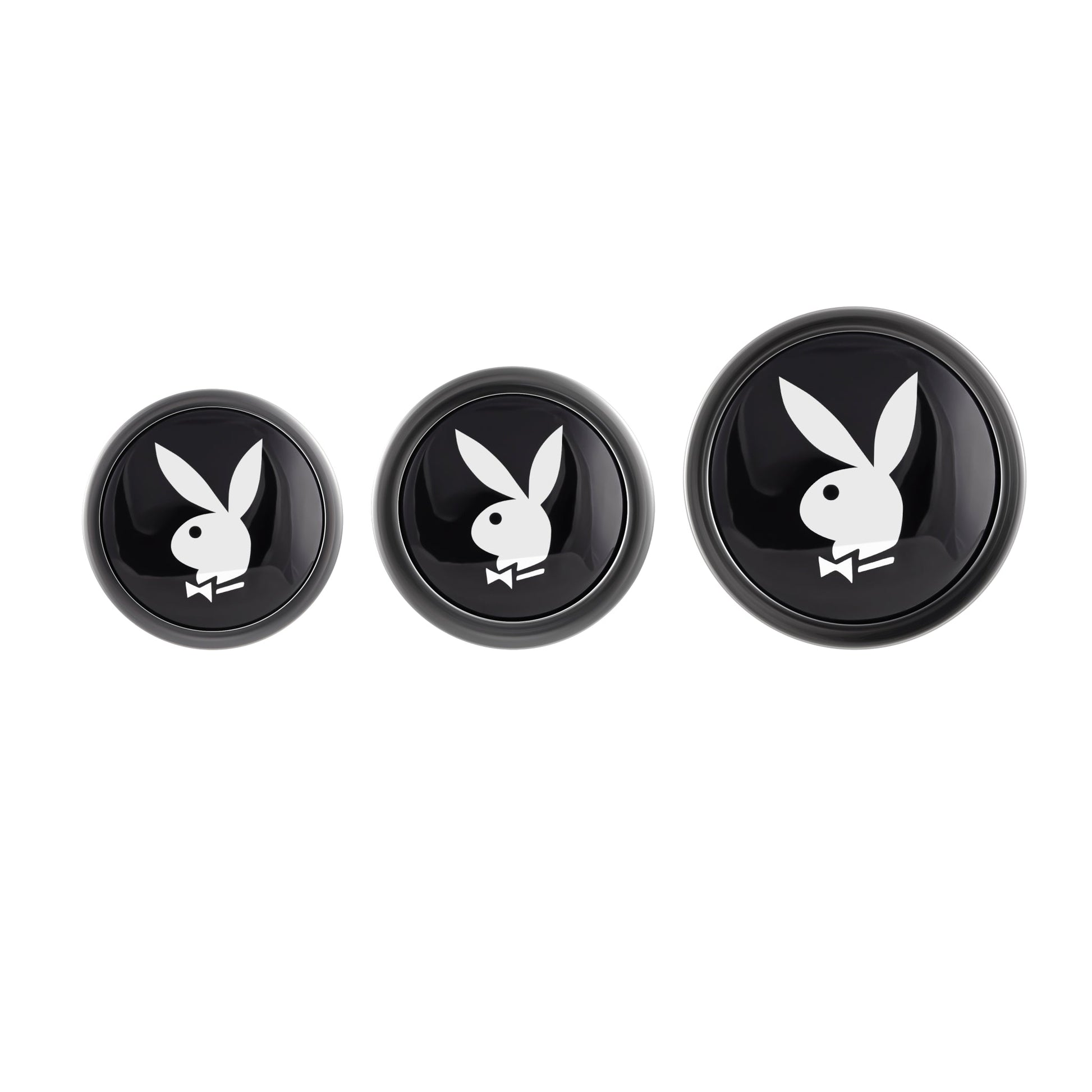 Three black round objects with the Playboy bunny logo.
