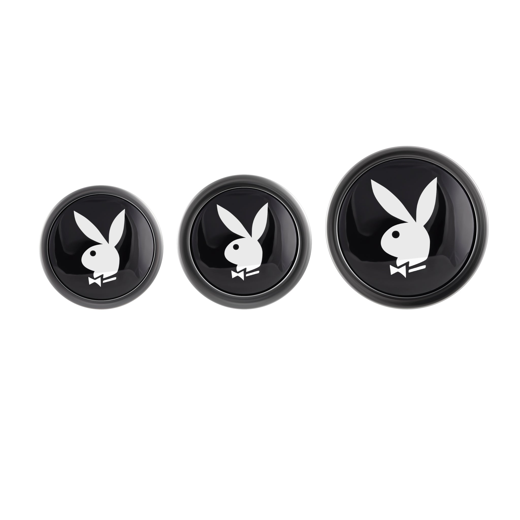 Three black round objects with the Playboy bunny logo.