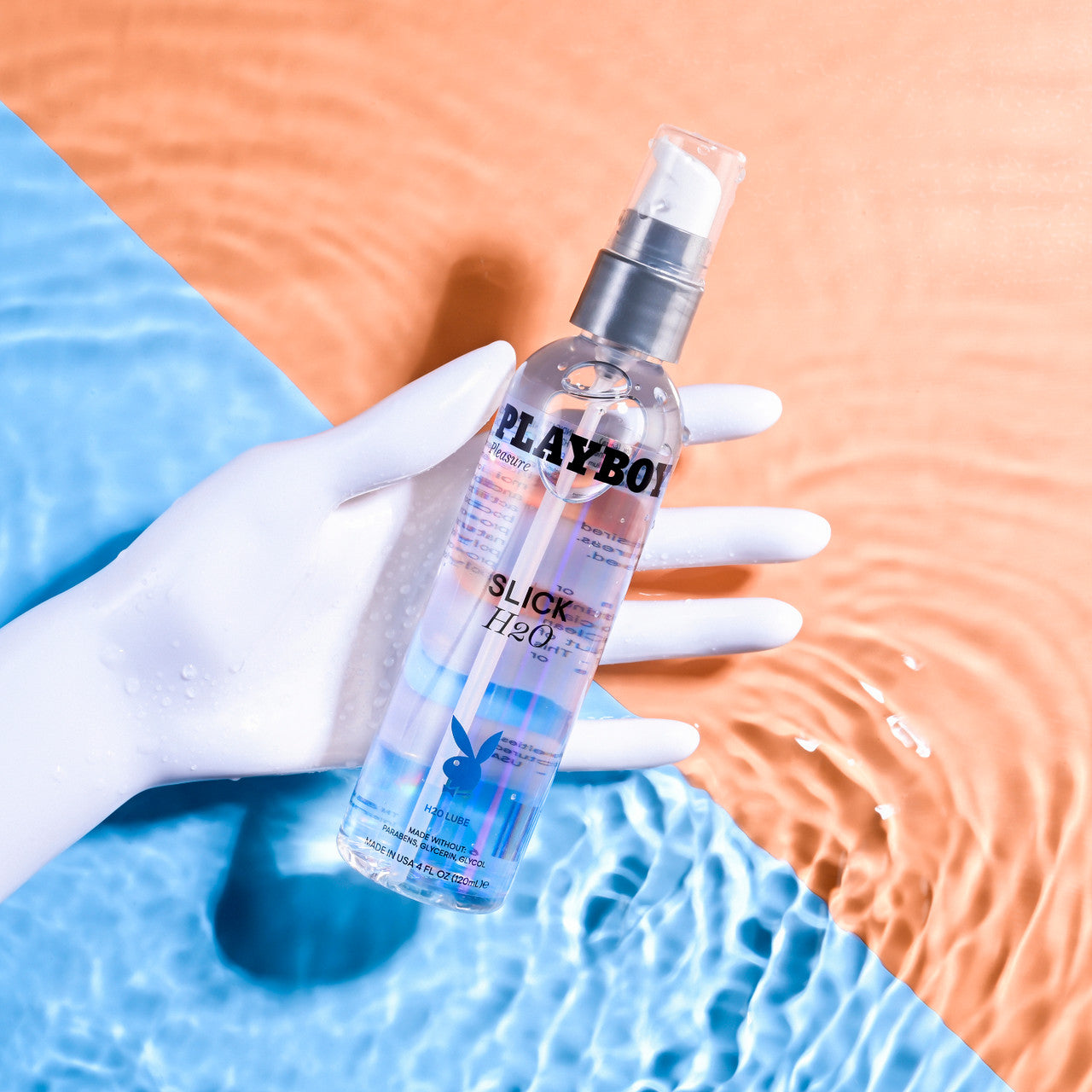 Playboy Slick H2O water-based lubricant in a clear bottle with a pump.