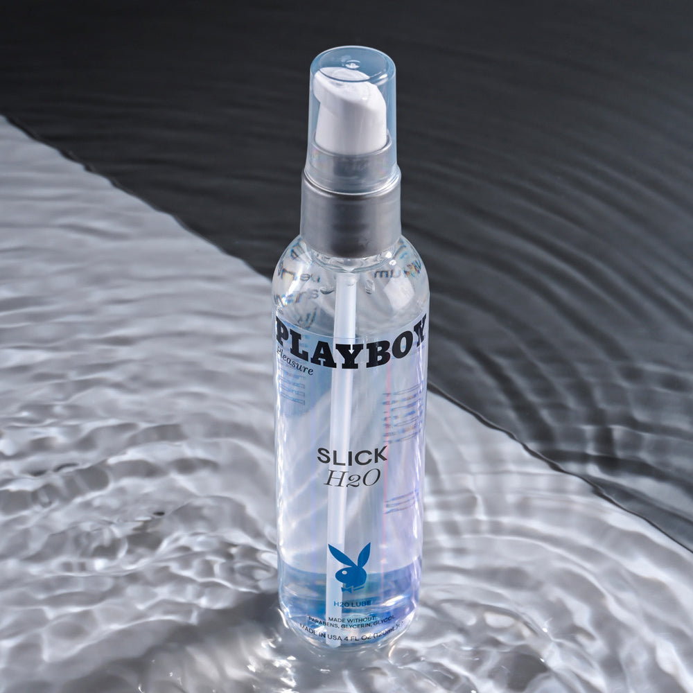 Playboy Slick H2O water-based lubricant in a clear pump bottle.