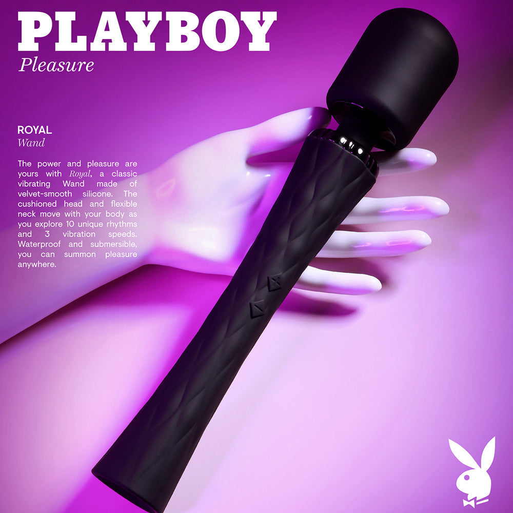 A black Playboy Royal vibrating wand with a textured handle rests on a mannequin hand.