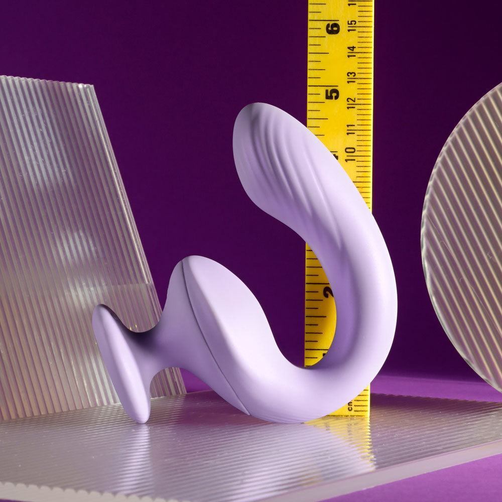 A purple G-spot vibrator with a curved design and textured shaft.