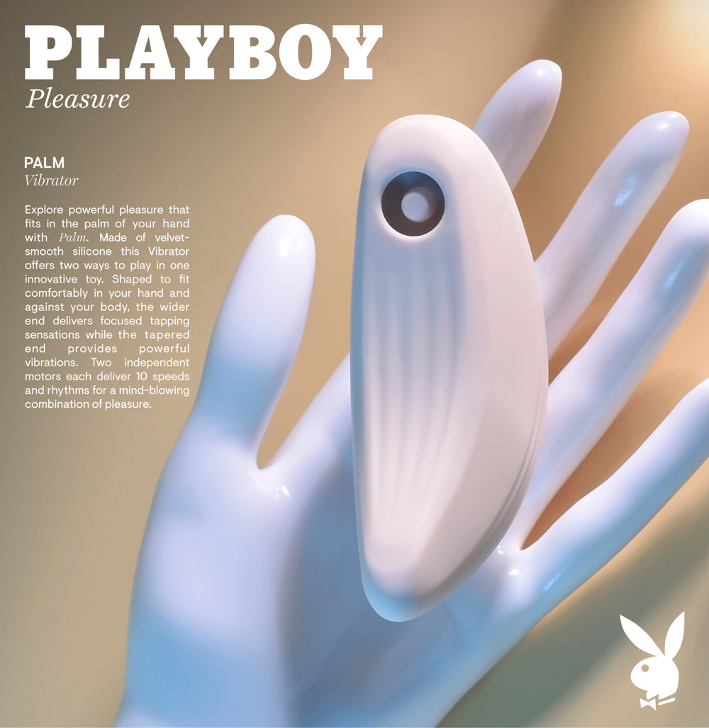 A white, palm-shaped vibrator with a circular button on a mannequin hand.