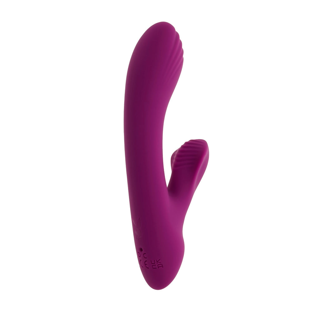 A purple rabbit vibrator with ribbed textures on the ears and tip.