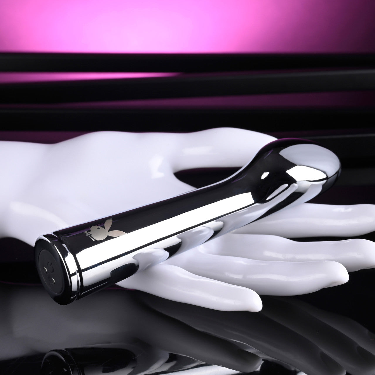 Playboy Swoon Metal Rechargeable Vibrator with Playboy bunny logo.