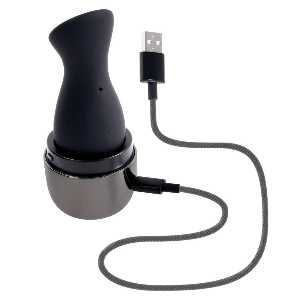 Black clitoral suction toy with USB charging cable and case.