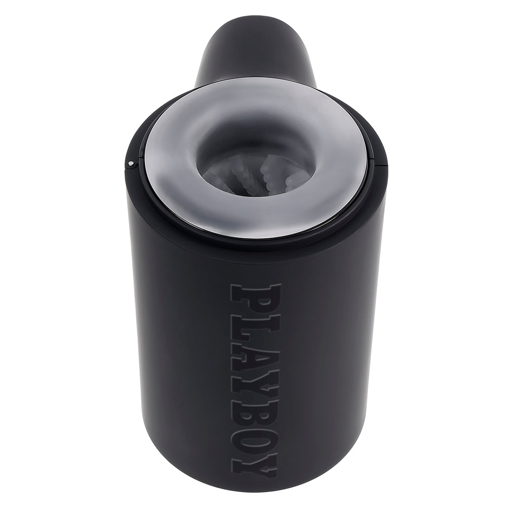 Black Playboy travel stroker with textured interior and a clear ring.