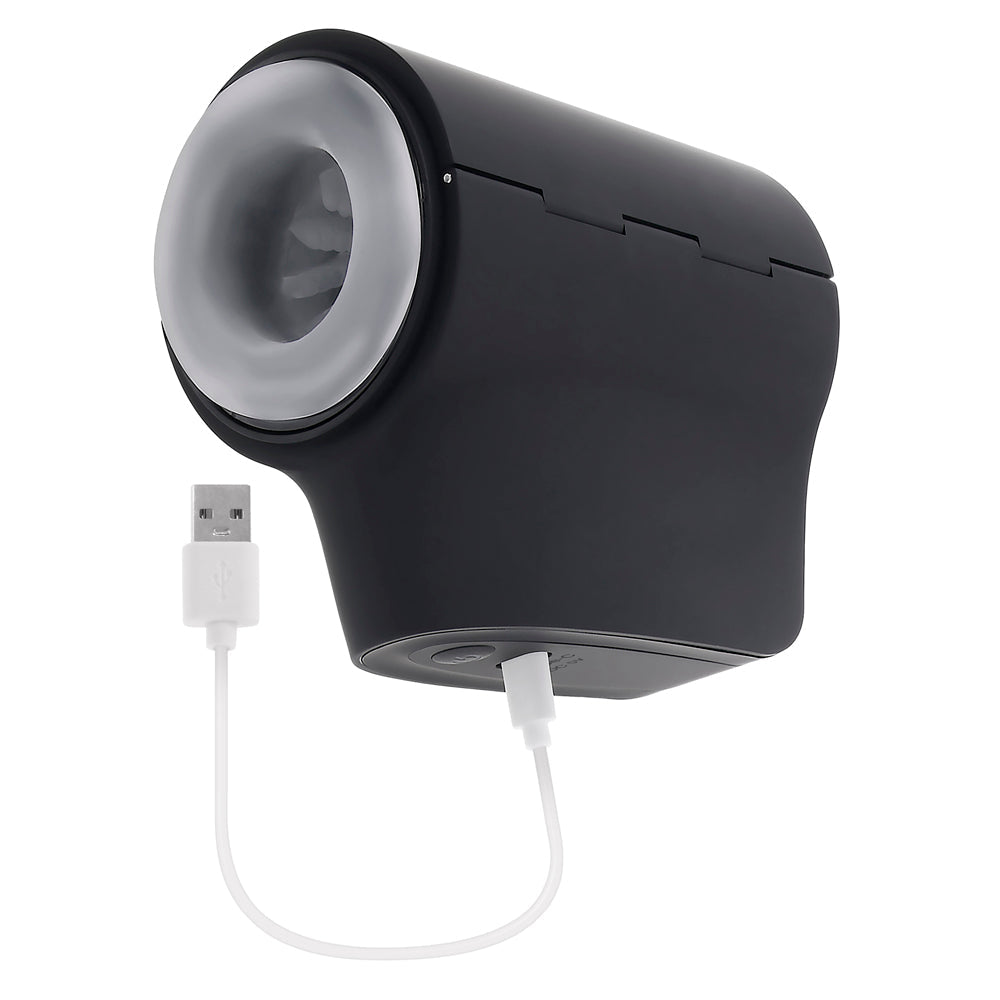 Black travel stroker with a grey opening and a white USB charging cable.