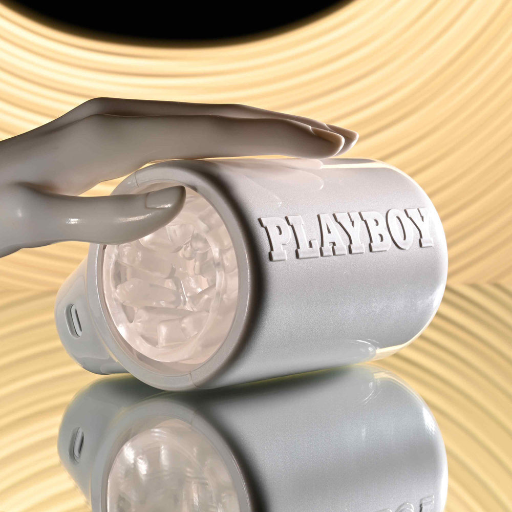 White Playboy spinning male masturbator with a reflective surface.