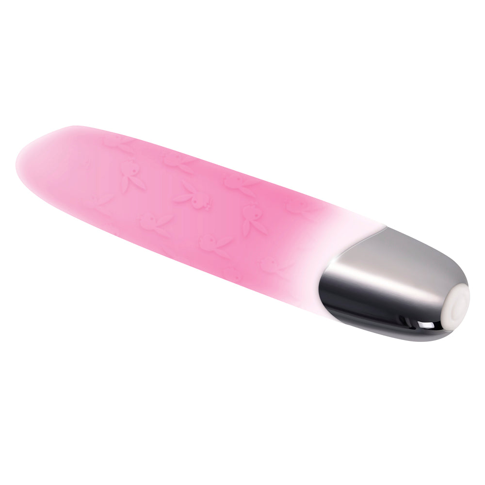 Pink silicone bullet vibrator with Playboy bunny pattern and silver tip.