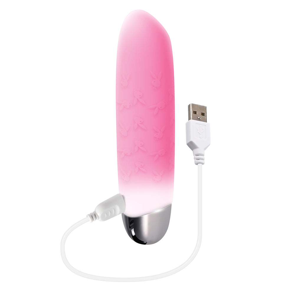 Pink silicone bullet vibrator with Playboy bunny pattern and USB charging cable.