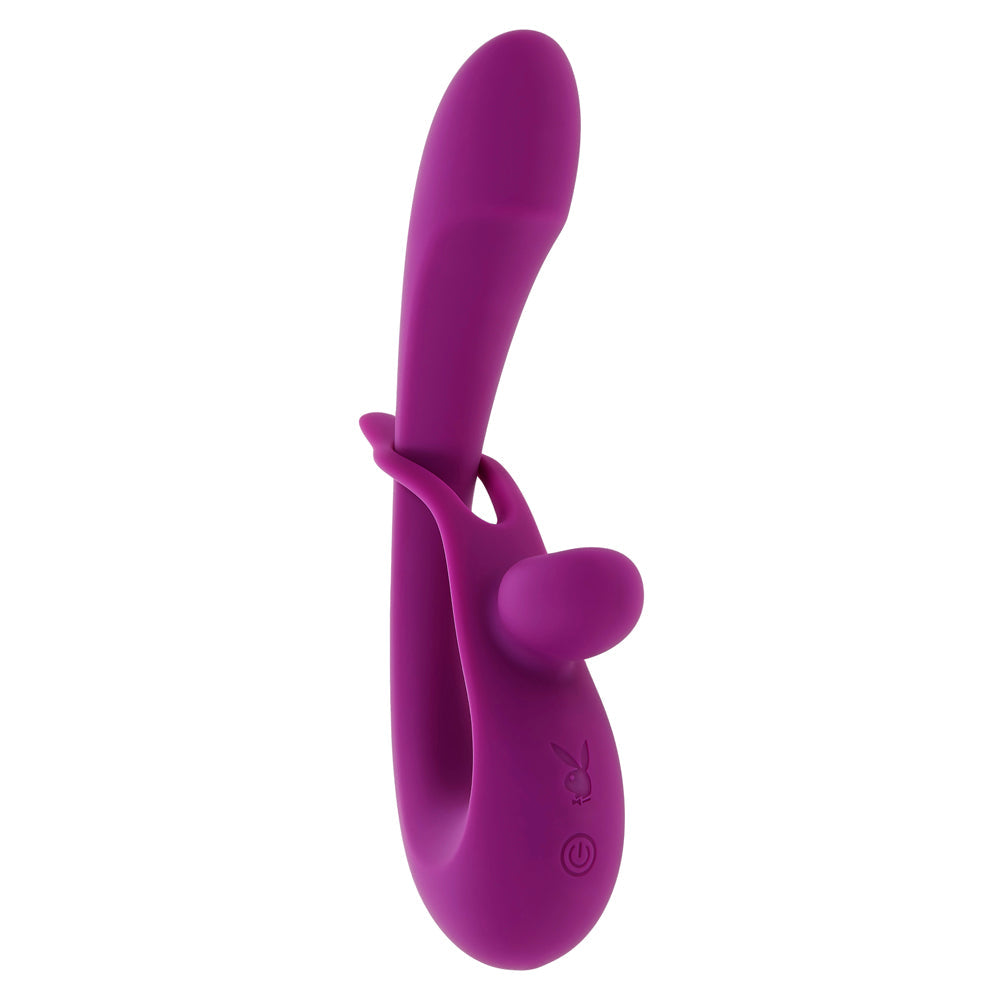 Purple dual silicone vibrator with a curved design and a small nub.