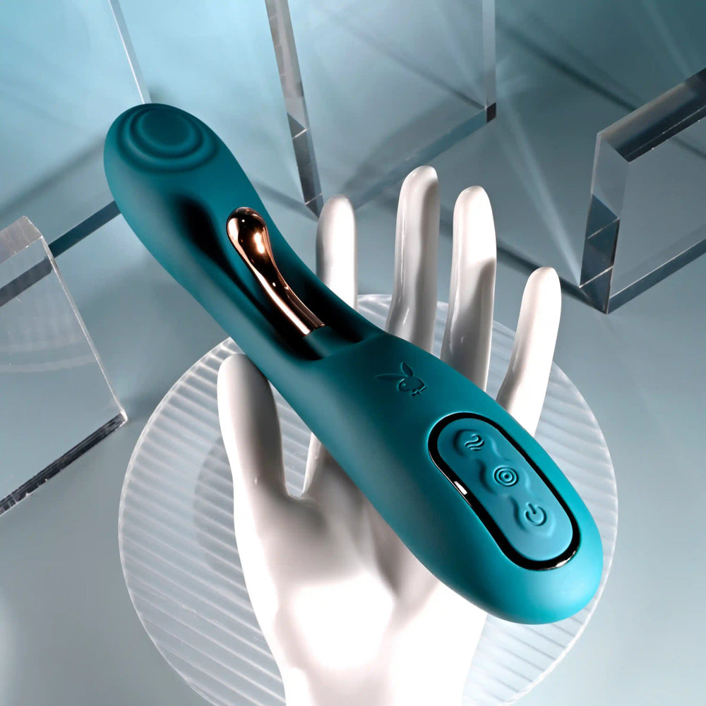 Teal silicone G-spot vibrator with rose gold accent and control buttons.