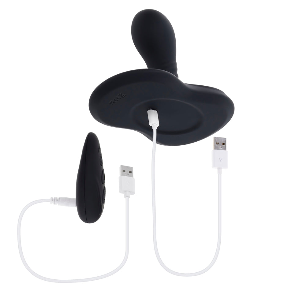 Black rotating vibe with remote and USB charging cables.