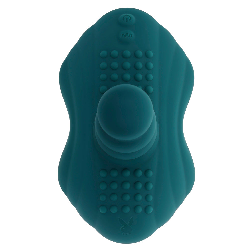 Teal silicone massager with a textured probe and suction base.