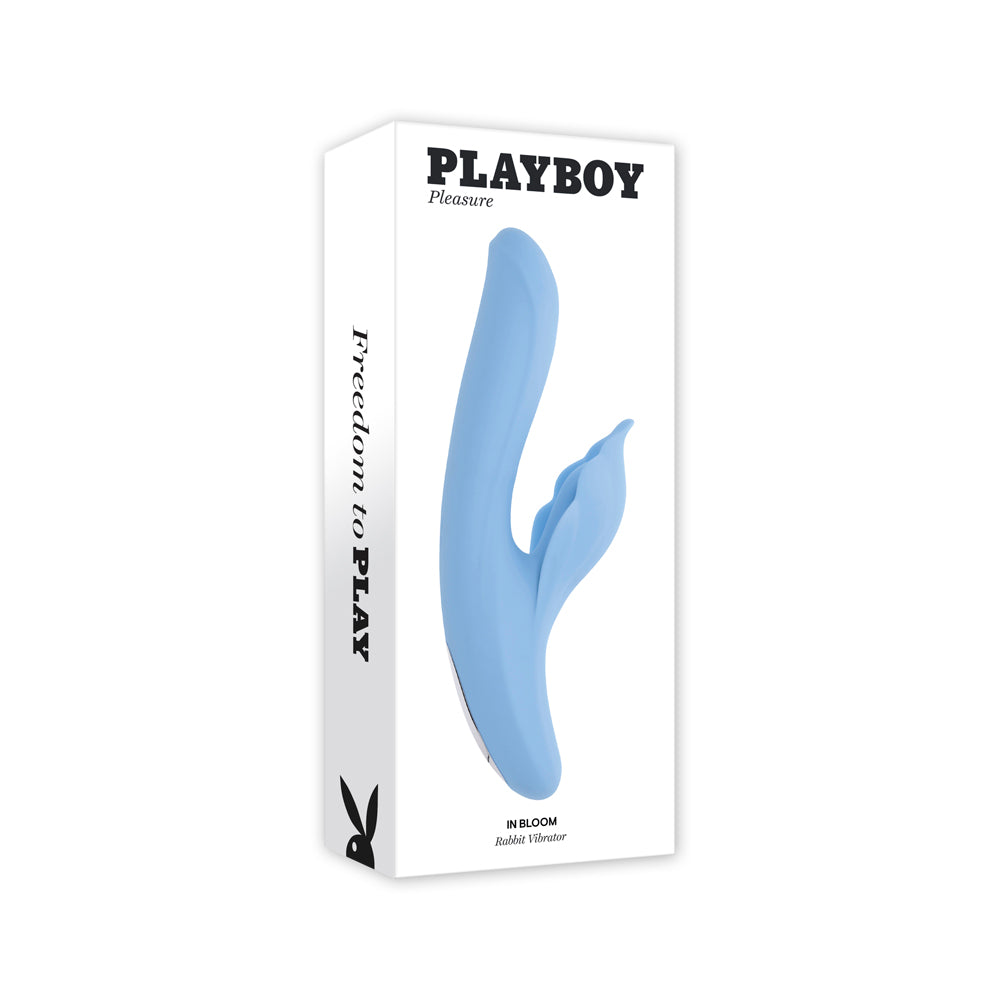 A light blue Playboy rabbit vibrator on a white box.