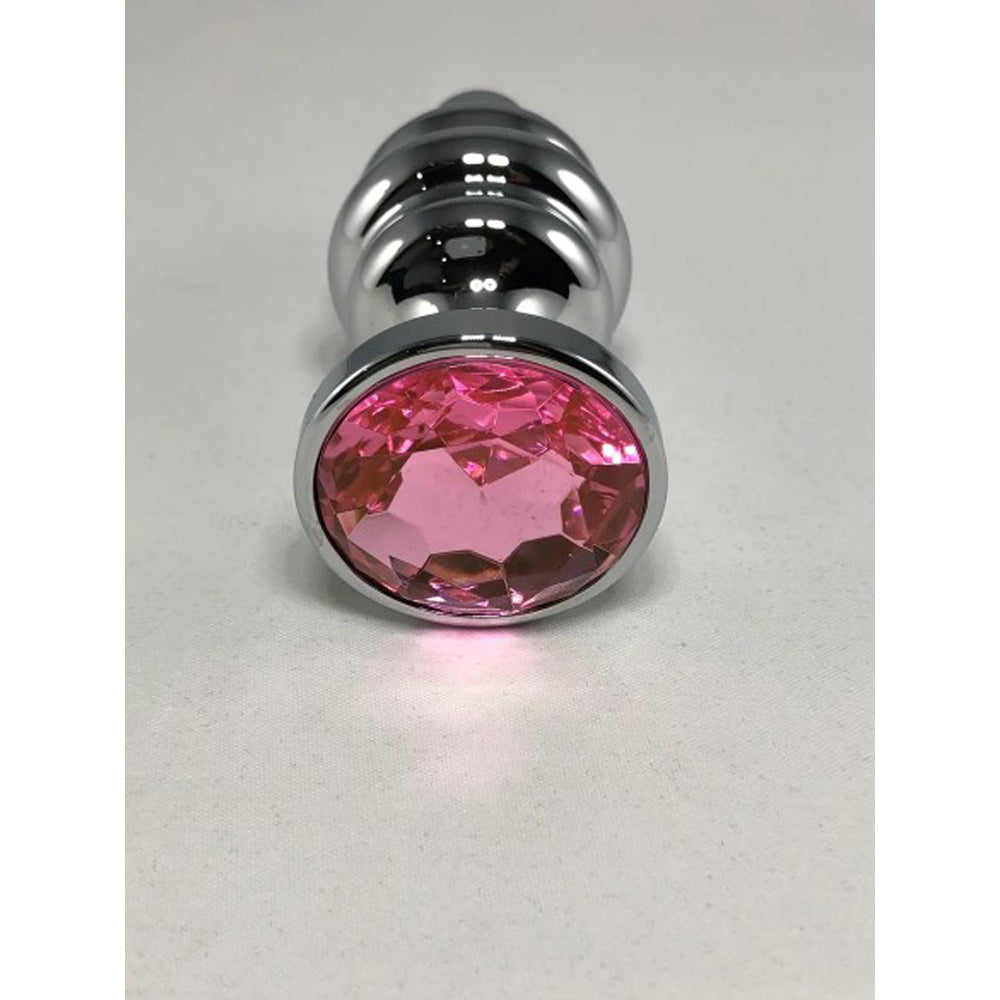 Large stainless steel threaded anal plug with a pink gem.