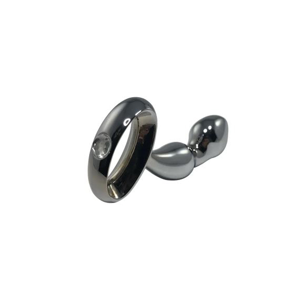 Large stainless steel anal plug with a loop handle.