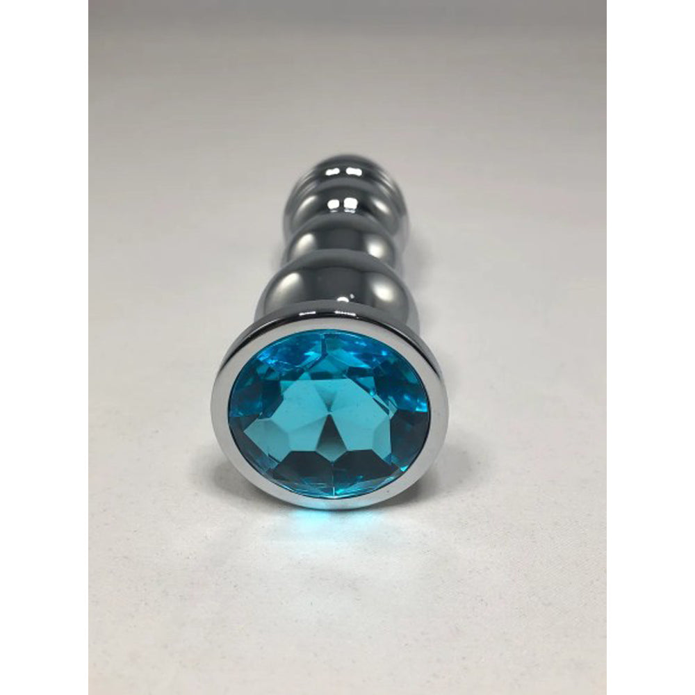 Large bullet anal plug with a faceted blue gem base.