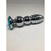 Large silver bullet anal plug with a blue gem base.