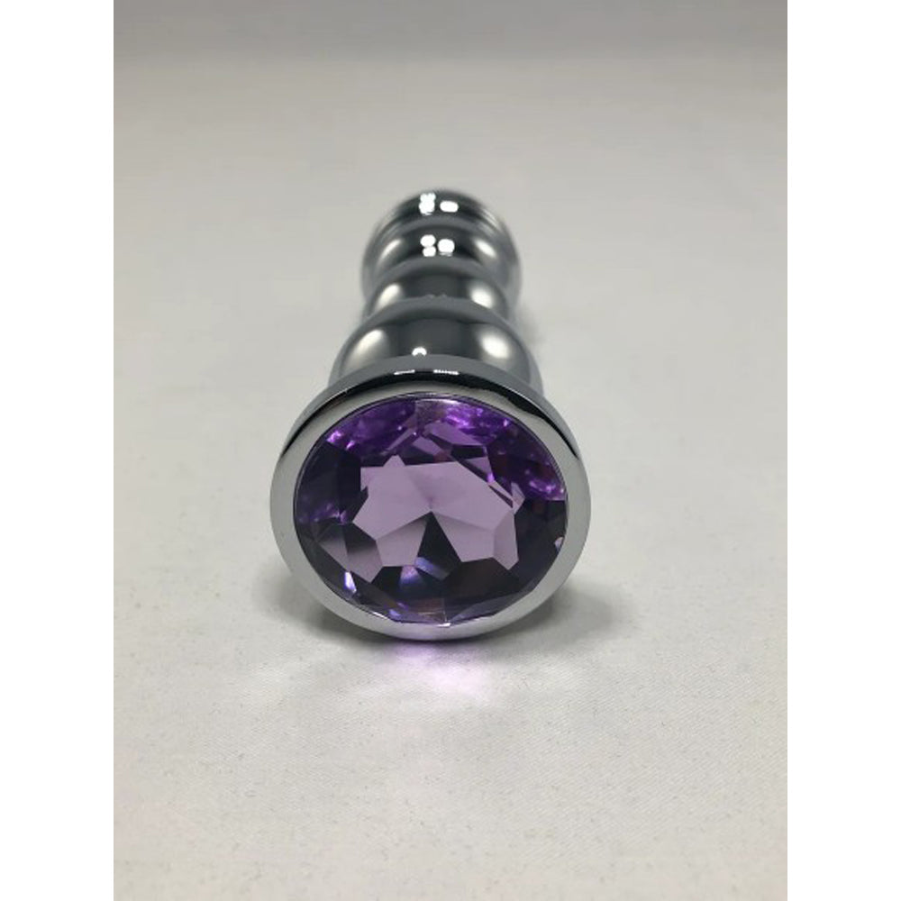 Large bud bullet anal plug with a faceted purple base.