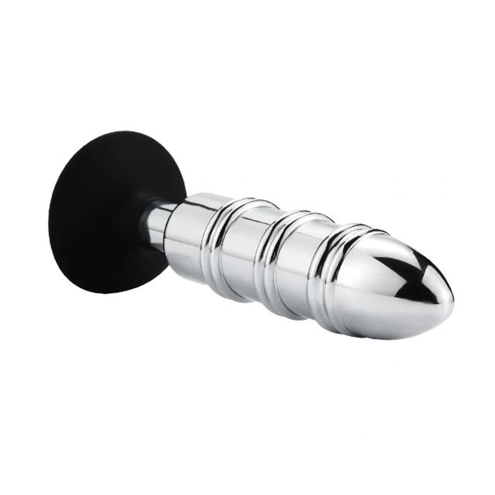 Stainless steel anal plug with a black suction cup base.