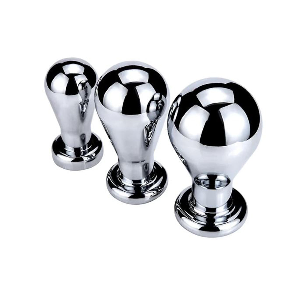 Three chrome-plated anal plugs with rounded tops and flared bases.