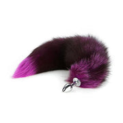 A large purple fox tail anal plug with a stainless steel base.