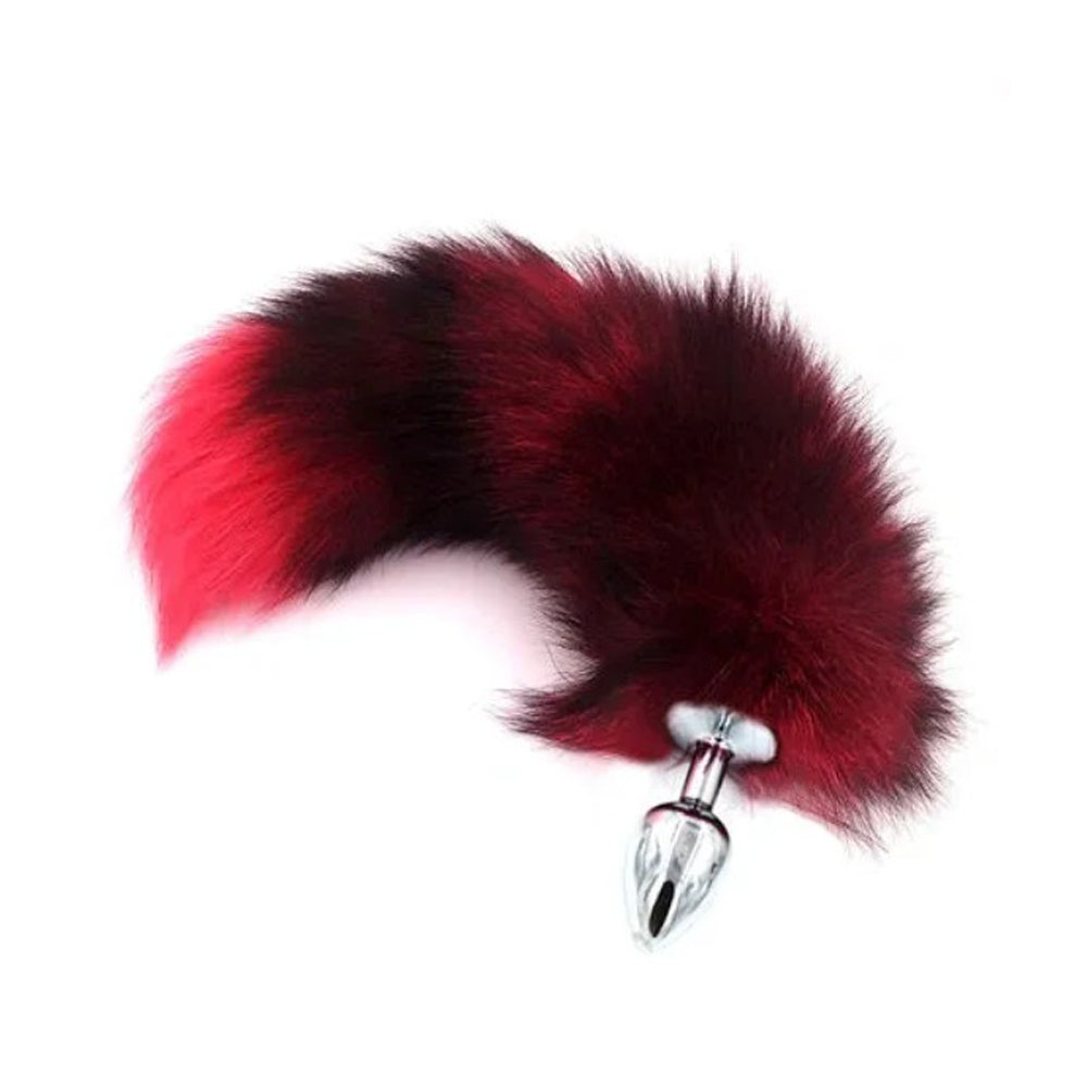 Large red and black faux fur fox tail anal plug with a silver metal base.