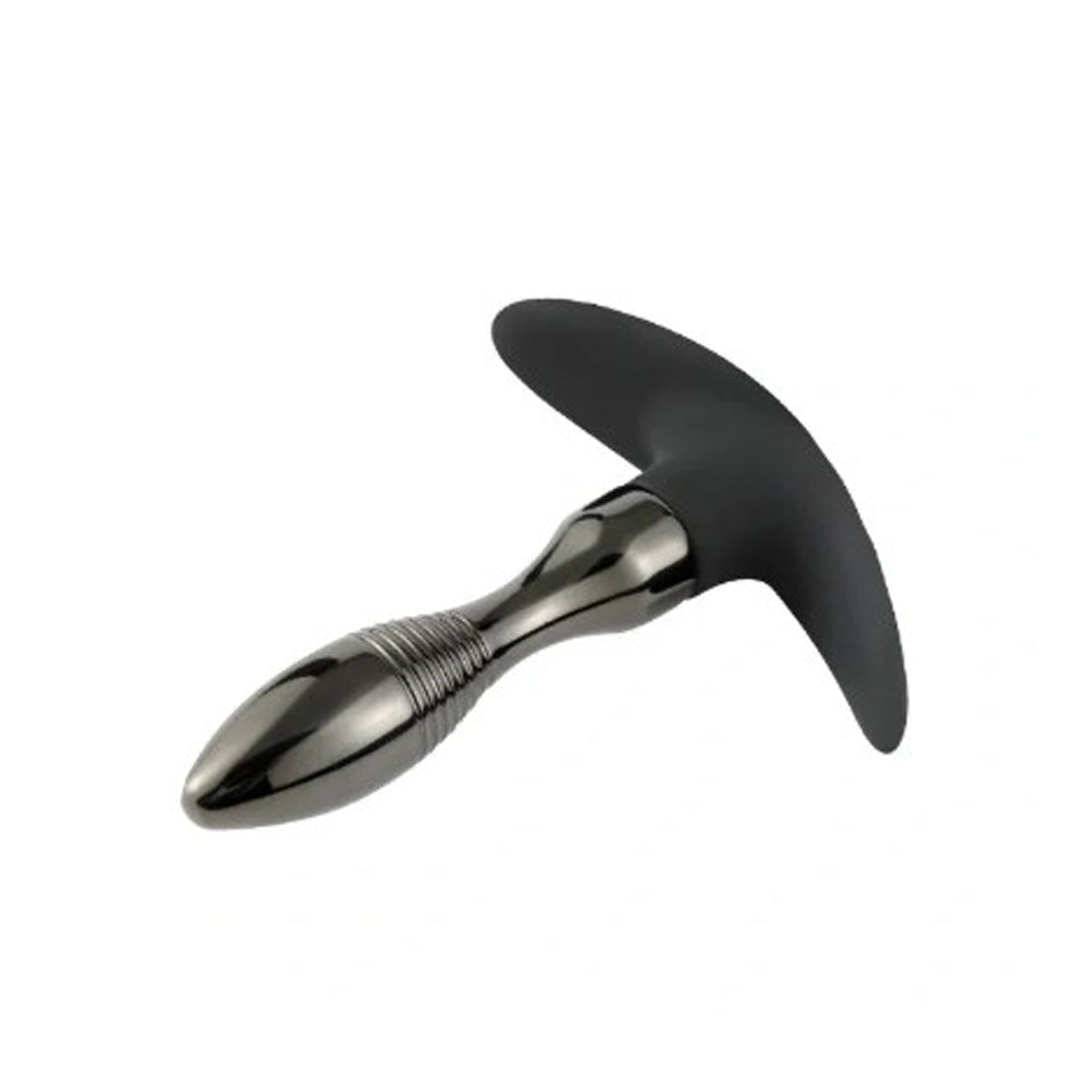 A black fox tail anal plug with a gunmetal tapered base.
