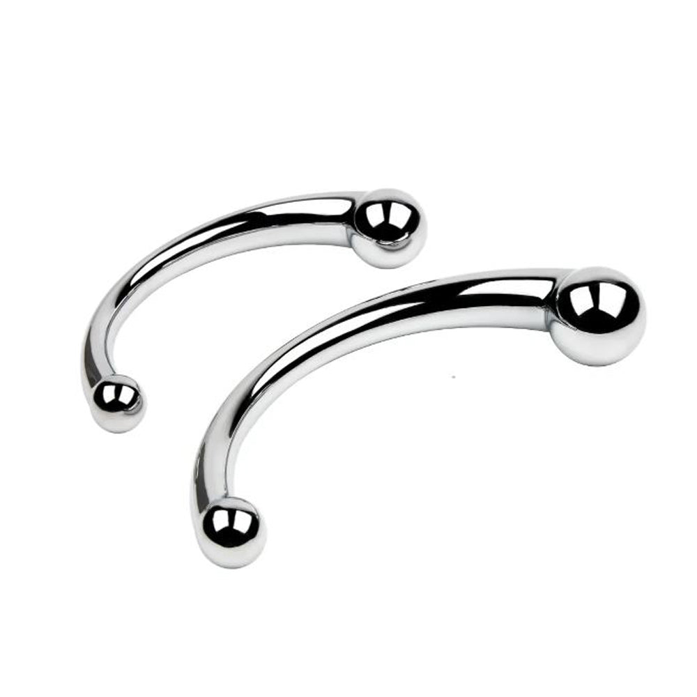 Two curved stainless steel massagers with rounded ends.
