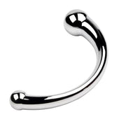 Curved, polished stainless steel massager with rounded ends.