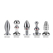 Five stainless steel mini anal plugs with gem accents.