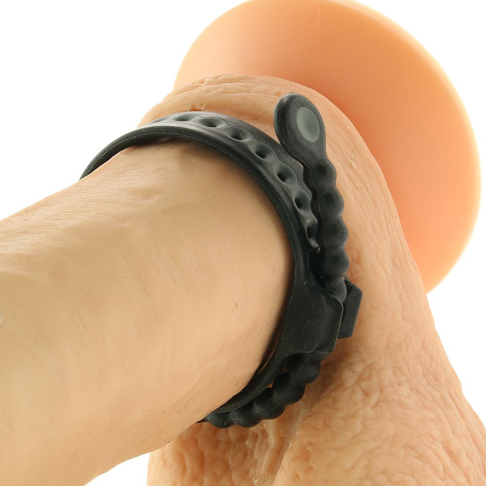 Adjustable black cock ring with a quick release tab.
