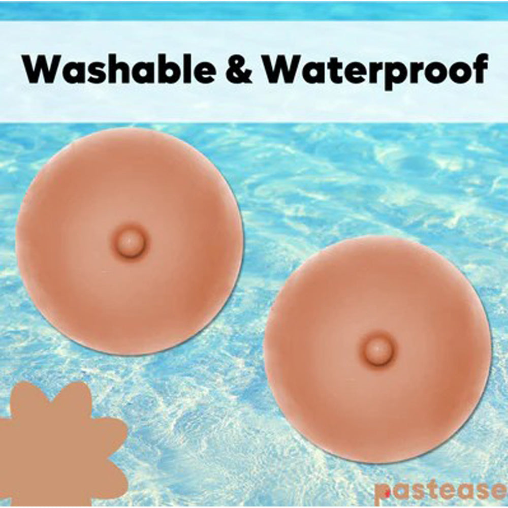 Two silicone nipple pasties with realistic hard centers on a blue water background.
