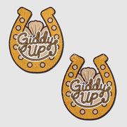Two golden horseshoe nipple pasties with "Giddy Up" text.