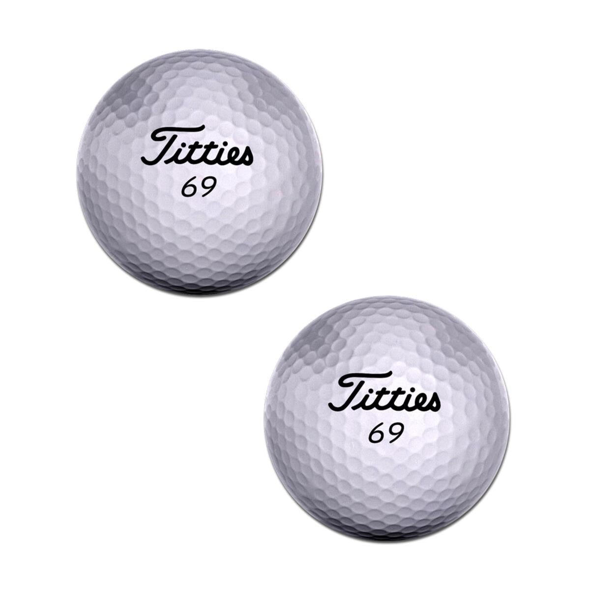 Two white golf balls with "Titties 69" printed on them.