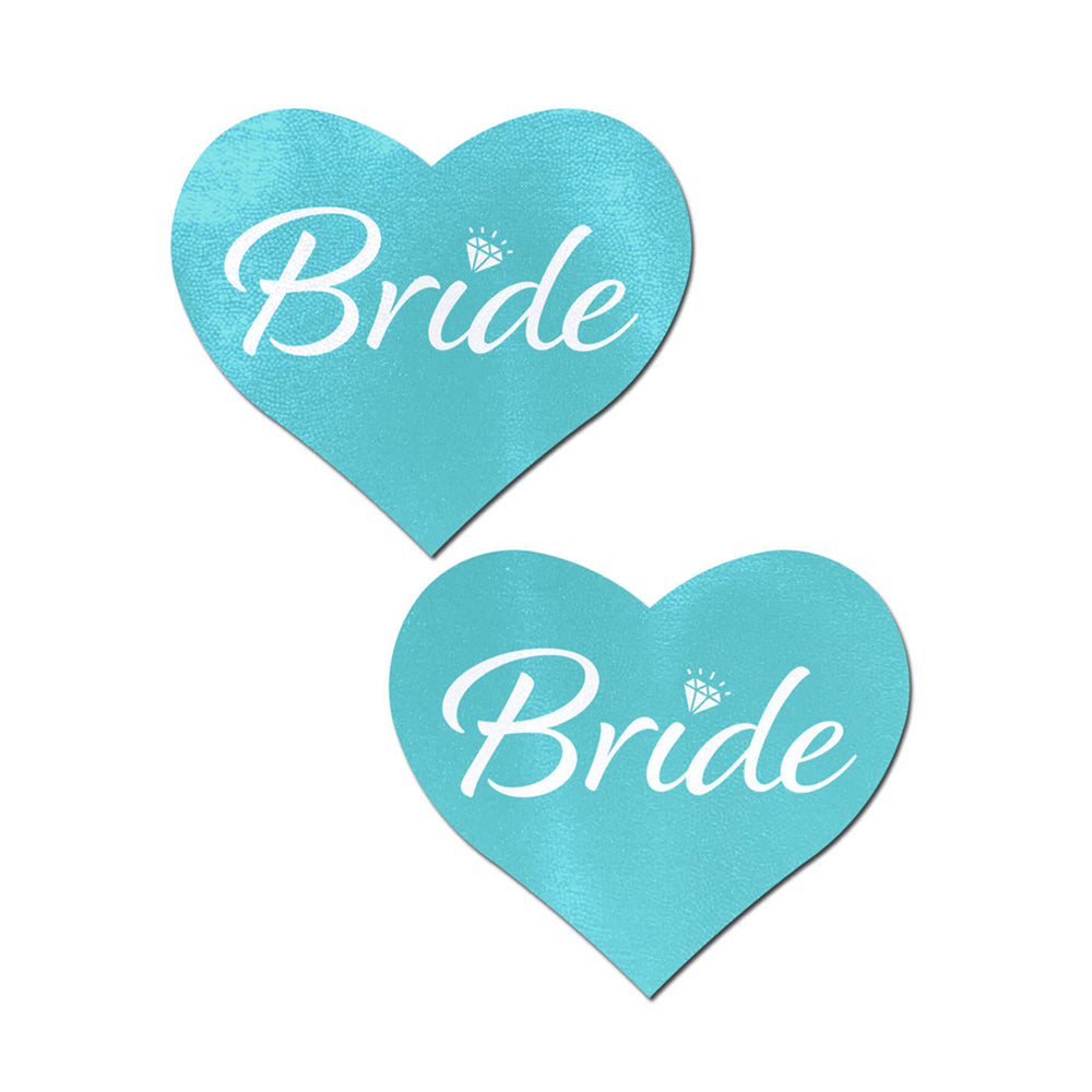 Two robin egg blue heart-shaped pasties with the word "Bride" in white script.