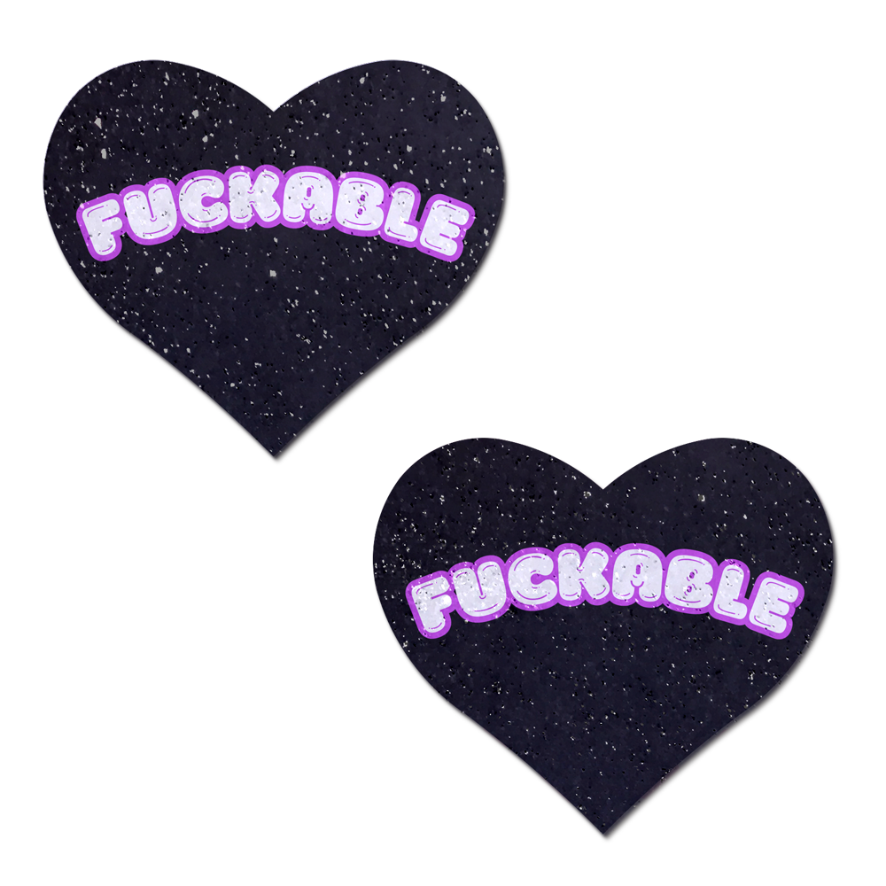 Two black heart-shaped pasties with "FUCKABLE" in pink bubble letters.