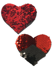 Two heart-shaped sequin pasties, one red and one red and black.
