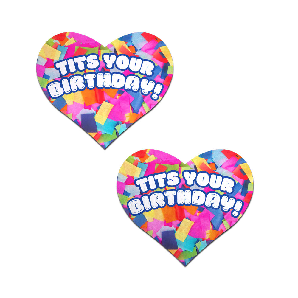 Two heart-shaped pasties with "Tits Your Birthday!" text and rainbow confetti.