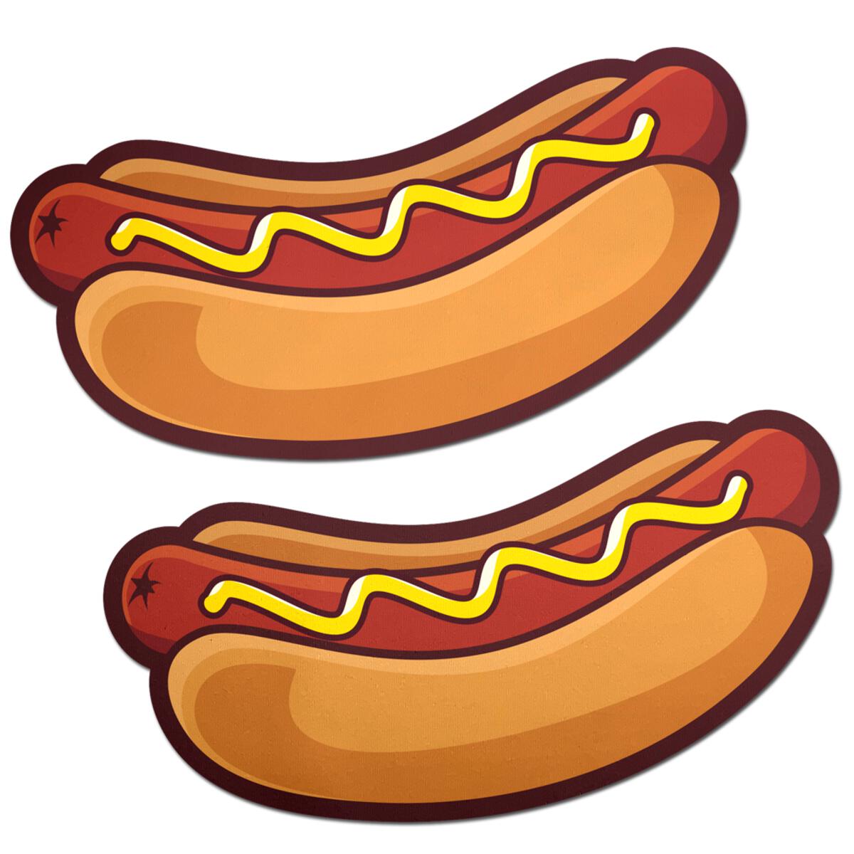 Two hotdog-shaped pasties with mustard drizzle.
