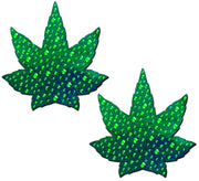 Two green pot leaf shaped nipple pasties with crystal accents.