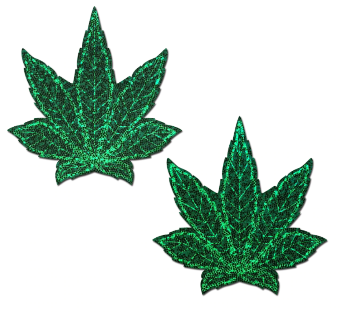 Two green glitter pot leaf nipple pasties on a white background.