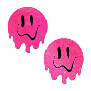 Two neon pink dripping smiley face nipple pasties.