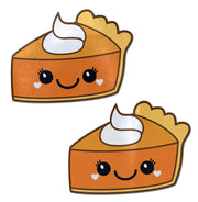 Two kawaii pumpkin pie pasties with whipped cream and heart accents.